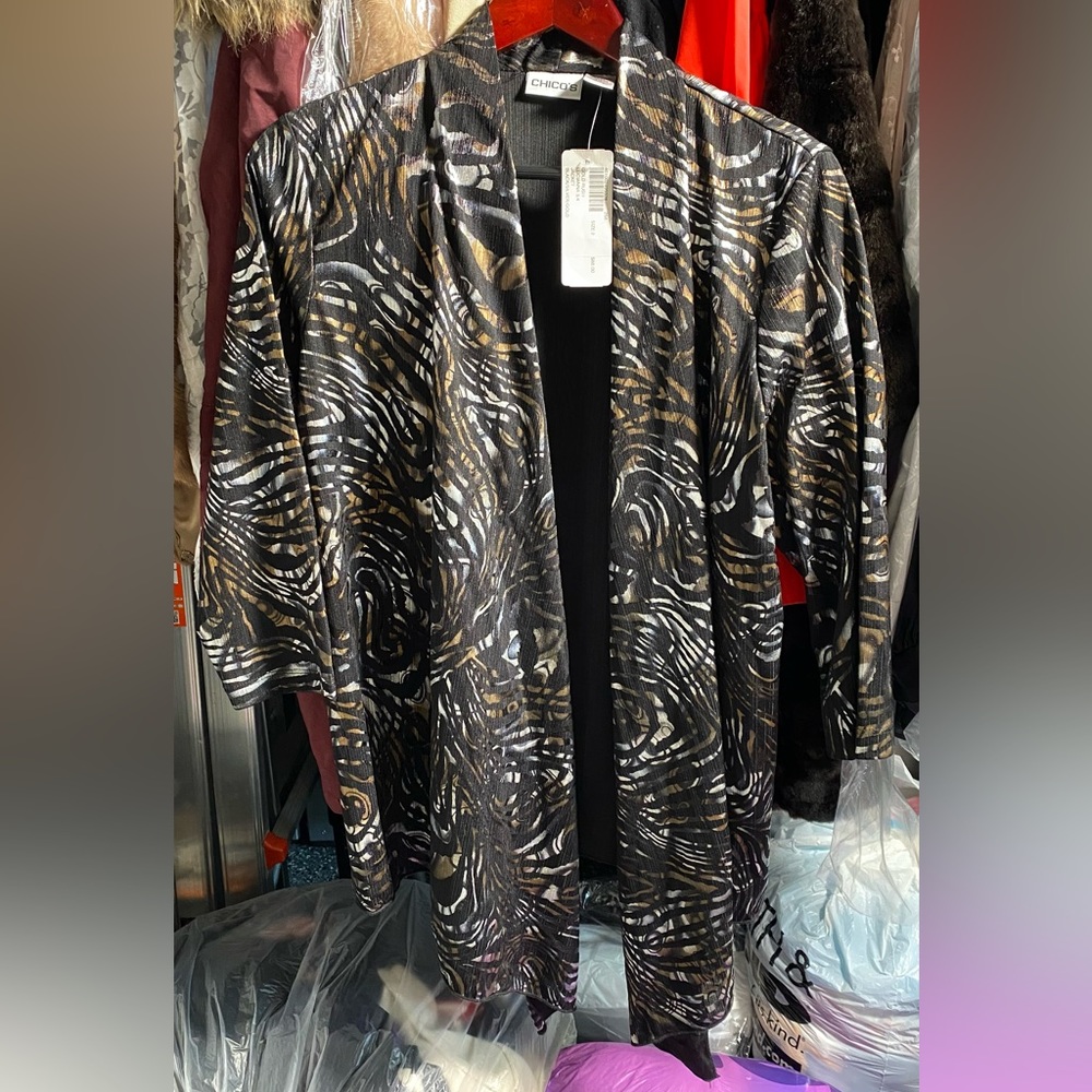 Elegant semi long print cardigan/vest size 2 from Chicos.